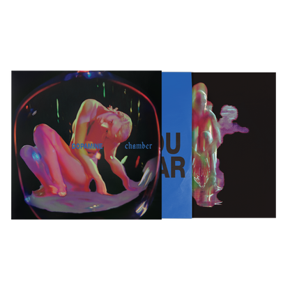 Vinyl cover with neon colorful graphic of a female on a black background with bright blue inner sleeve with bold black text. 